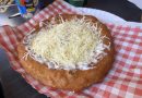 Classic langos with cheese and sour cream at Krumplis Budapest