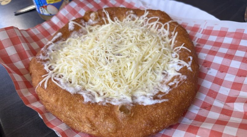 Classic langos with cheese and sour cream at Krumplis Budapest