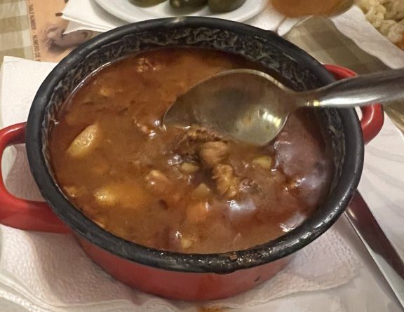 Goulash soup served in a red-handled pot at Frici Papa