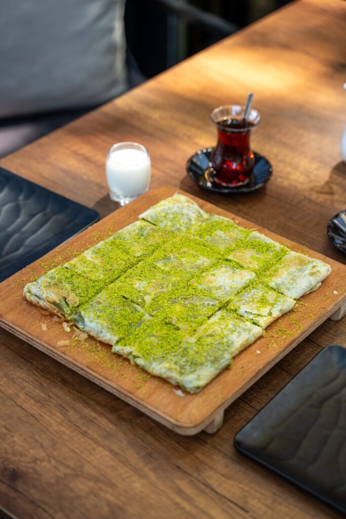 Katmer served with milk and tea at Metanet Katmer in Gaziantep