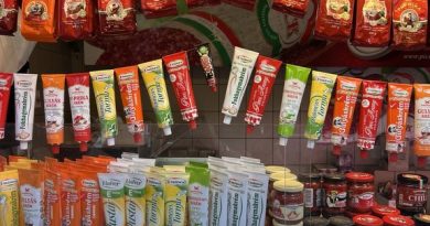 Paprika powders and pepper pastes on shelves at Budapest Central Market Hall