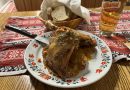 Roast duck served over cabbage and potato tócsni at Pipa Étterem
